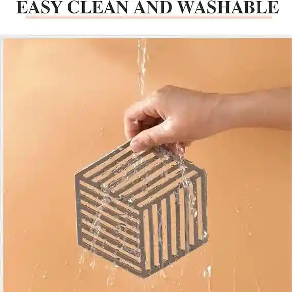 Hand holding a small wooden crate with water flowing through it against an orange background, with text 'EASY CLEAN AND WASHABLE' at the top.
