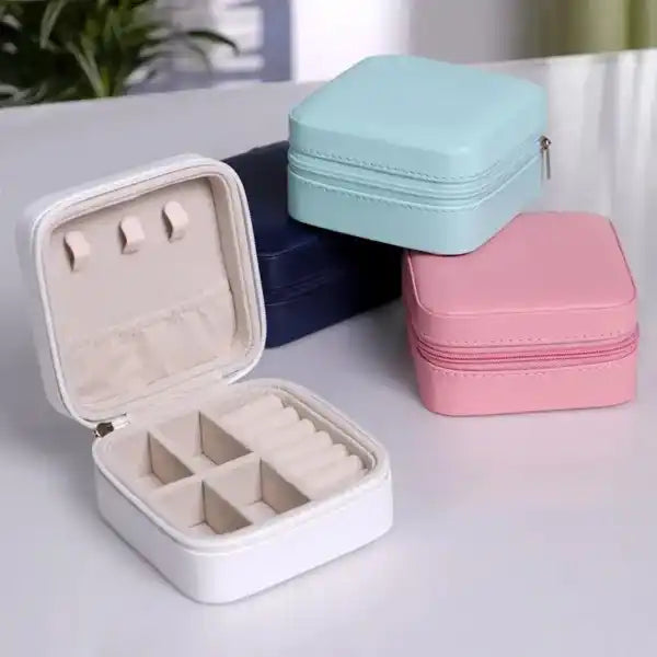 Jewelry boxes in various colors on a light surface