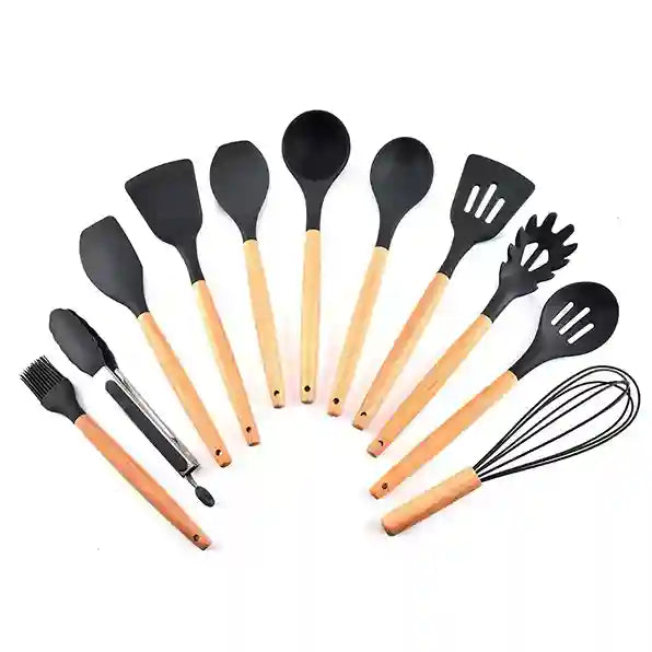 Set of kitchen utensils with black silicone heads and wooden handles on a white background