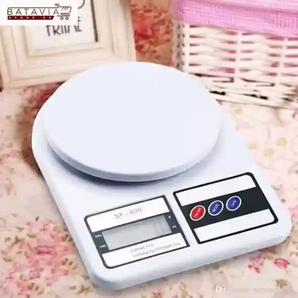 Digital kitchen scale on a floral surface with a blurred background