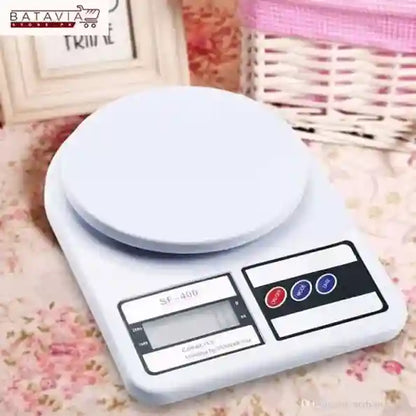 Digital kitchen scale on a floral surface with a blurred background