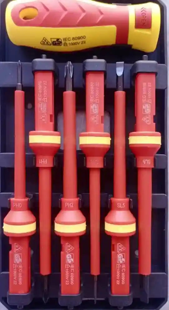 Set of insulated screwdrivers with red handles and yellow accents on a black background