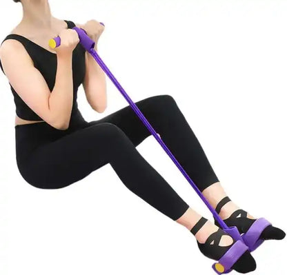 Person using a purple resistance band for leg exercise on a white background