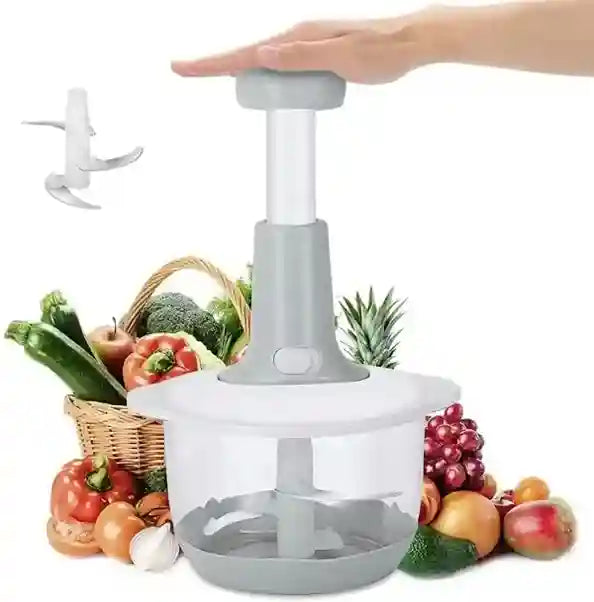 Handheld vegetable chopper with fruits and vegetables in the background