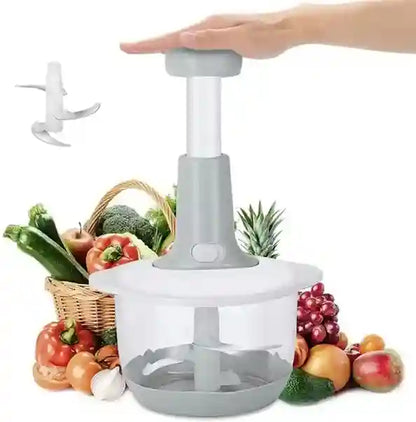 Handheld vegetable chopper with fruits and vegetables in the background