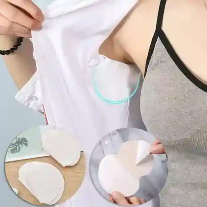 Person applying adhesive patches to their skin with a focus on the product.