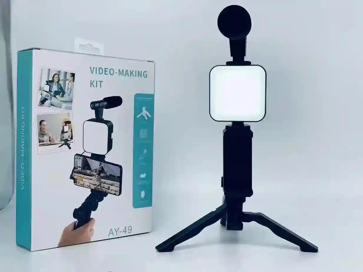 Video-making kit with light and tripod on a white background