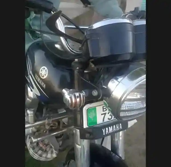 Close-up of a Yamaha motorcycle with a visible license plate.