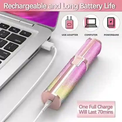 Pink and rainbow-colored USB adapter with charging cable on a white surface, connected to a laptop.