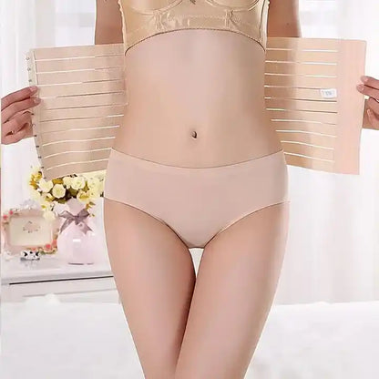 Person wearing beige underwear with a white background