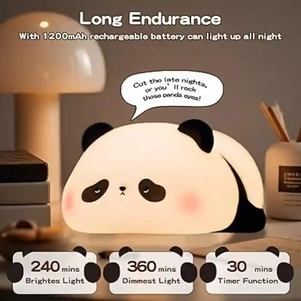 Panda-shaped night light with text and battery information on a desk.