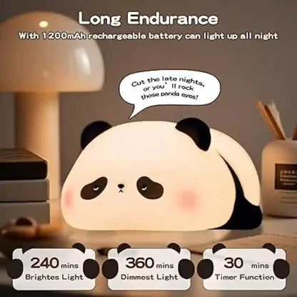 Panda-shaped night light with text and battery information on a desk.