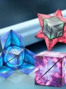 Three colorful geometric crystal sculptures on a reflective surface