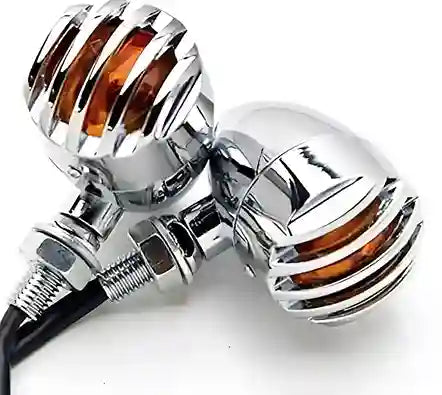 Chrome motorcycle turn signals with amber lenses on a white background