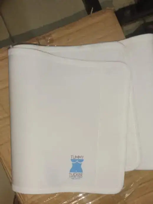 White blanket with a logo on a wooden surface
