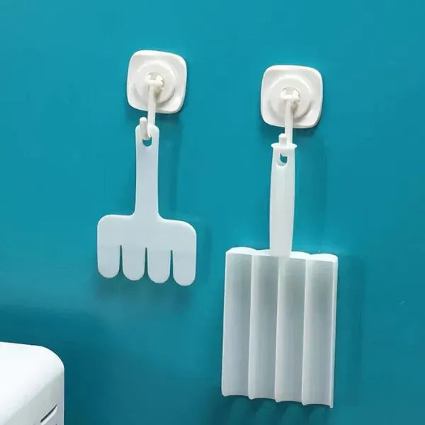 Two white cleaning tools with suction cups on a blue background