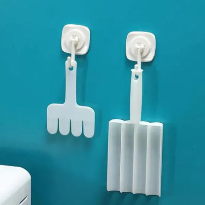 Two white cleaning tools with suction cups on a blue background