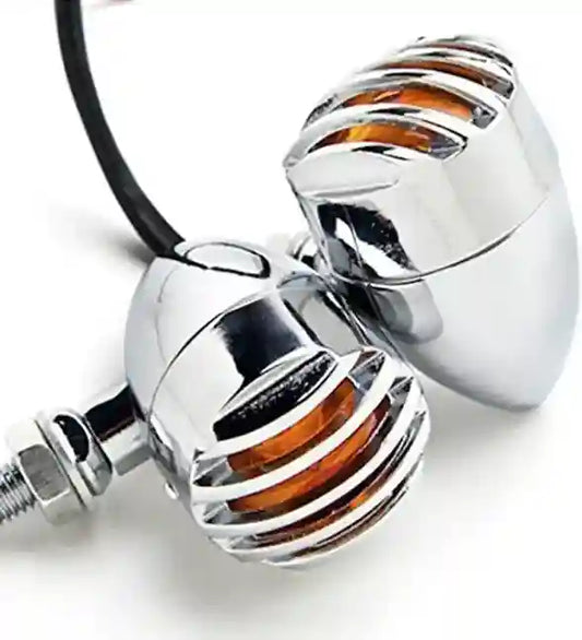 Chrome motorcycle handlebar risers with orange accents on a white background