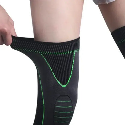 Black knee brace with green stitching on a white background