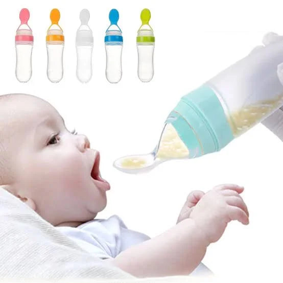Baby being fed with a silicone spoon and bottle, with additional bottles shown in the corner.