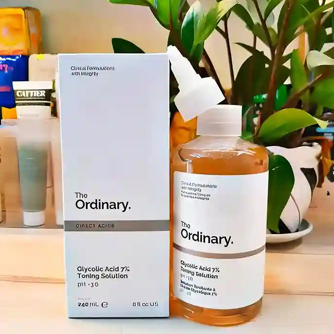 The Ordinary skincare product on a table with a plant in the background