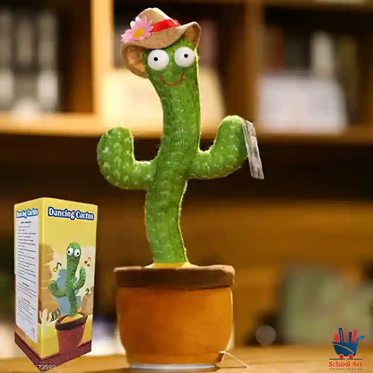 Plush toy cactus with a hat and flower, next to its packaging box, on a blurred background.