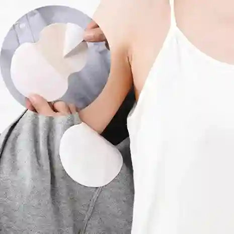 Person applying adhesive patches on their arm with a close-up of the patches.