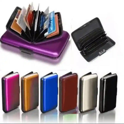 A set of slim metal cardholder wallets shown open and closed, with several color options lined up below. The main featured item at the top left is metallic purple, with other visible colors including black, pink, gold, blue, brown, silver, and black.