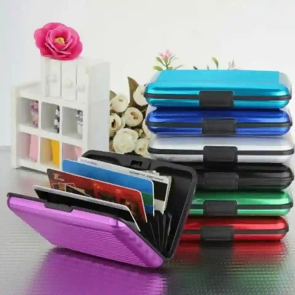 Stack of colorful card holders with a floral and decorative background