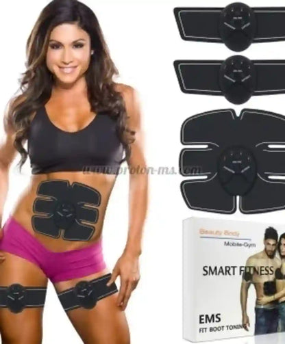 A woman wearing a black EMS abdominal trainer belt on her stomach, with additional black EMS pads and a product box shown on a white background. The box reads 'Beauty Body Mobile-Gym SMART FITNESS EMS FIT BOOT TONING'.