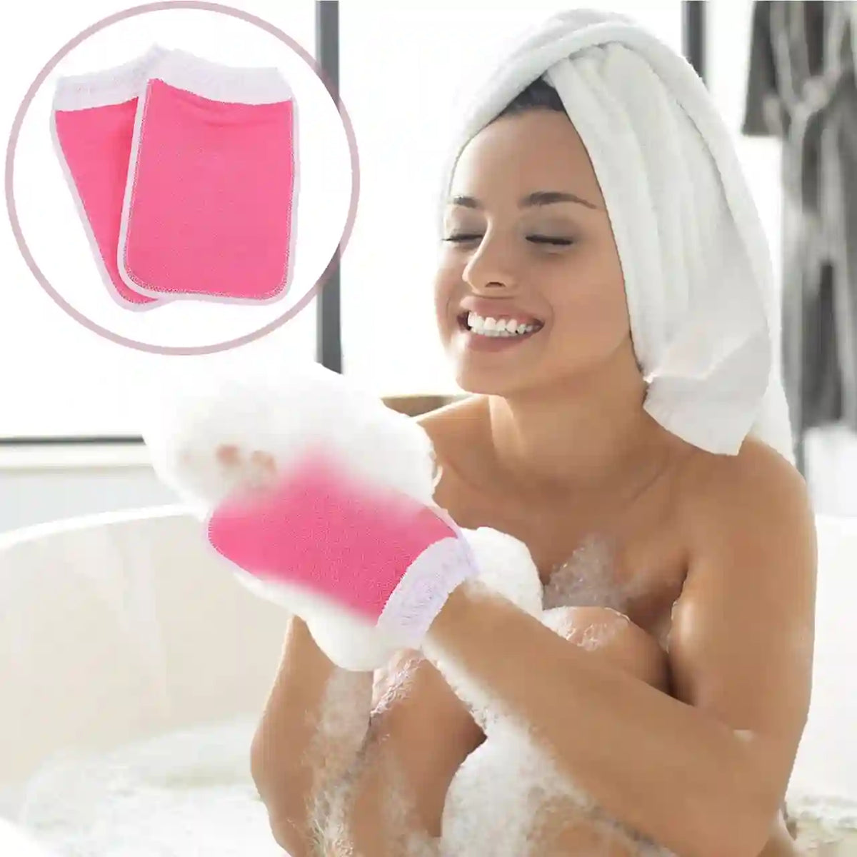 A smiling woman with a white towel wrapped around her head sits in a bubble bath while wearing a bright pink and white foam mitt. An inset circle in the upper left shows two pink foam mitts.