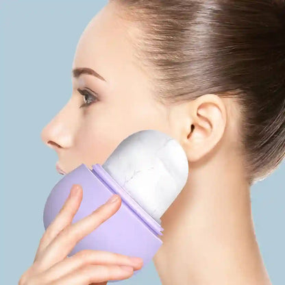 A close-up of a woman applying white facial cream or makeup with a lavender purple-handled applicator against a light blue background.