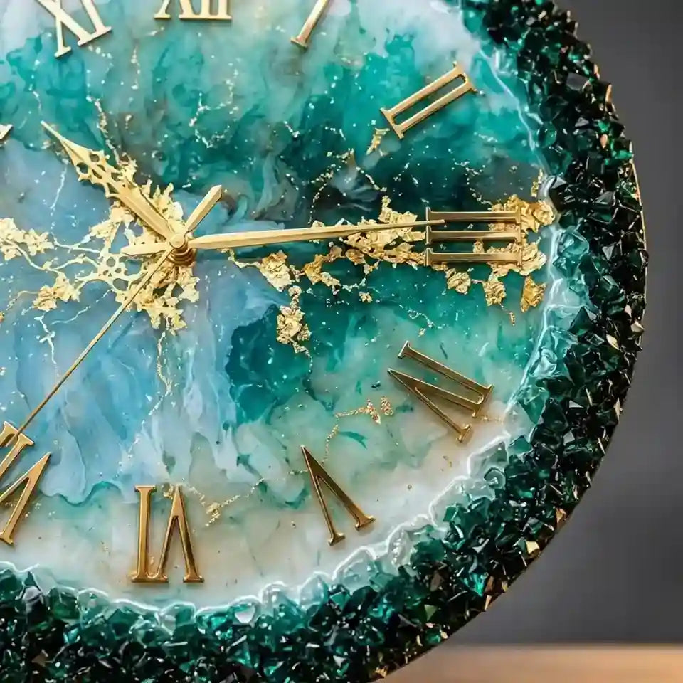 Close-up of a decorative wall clock face with a teal and aqua marbled design, gold Roman numerals, gold hands, and a dark green faceted crystal-like border.