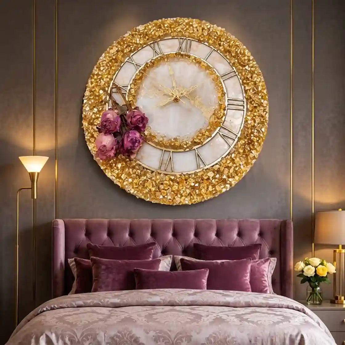 A large round wall clock with a glittery gold frame, white marble center, and purple roses, mounted above a tufted purple bed in a modern bedroom.