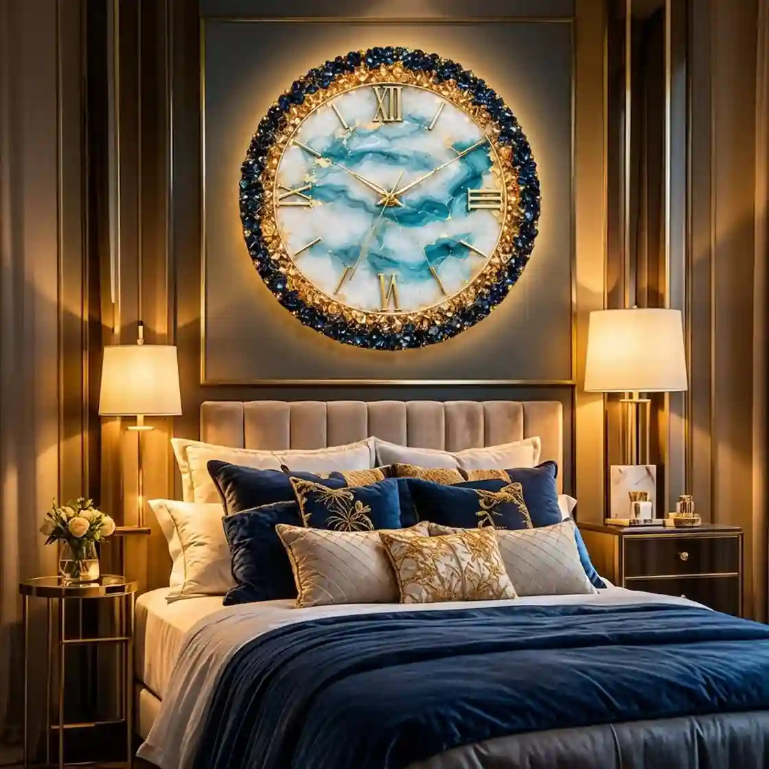 A large round wall clock with a blue and white marble face and a gold and dark blue beaded frame, mounted above a bed in a luxurious bedroom setting.