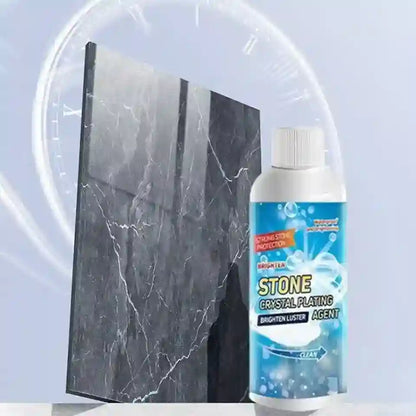 Bottle of stone crystal plating agent next to a marble slab on a light blue background