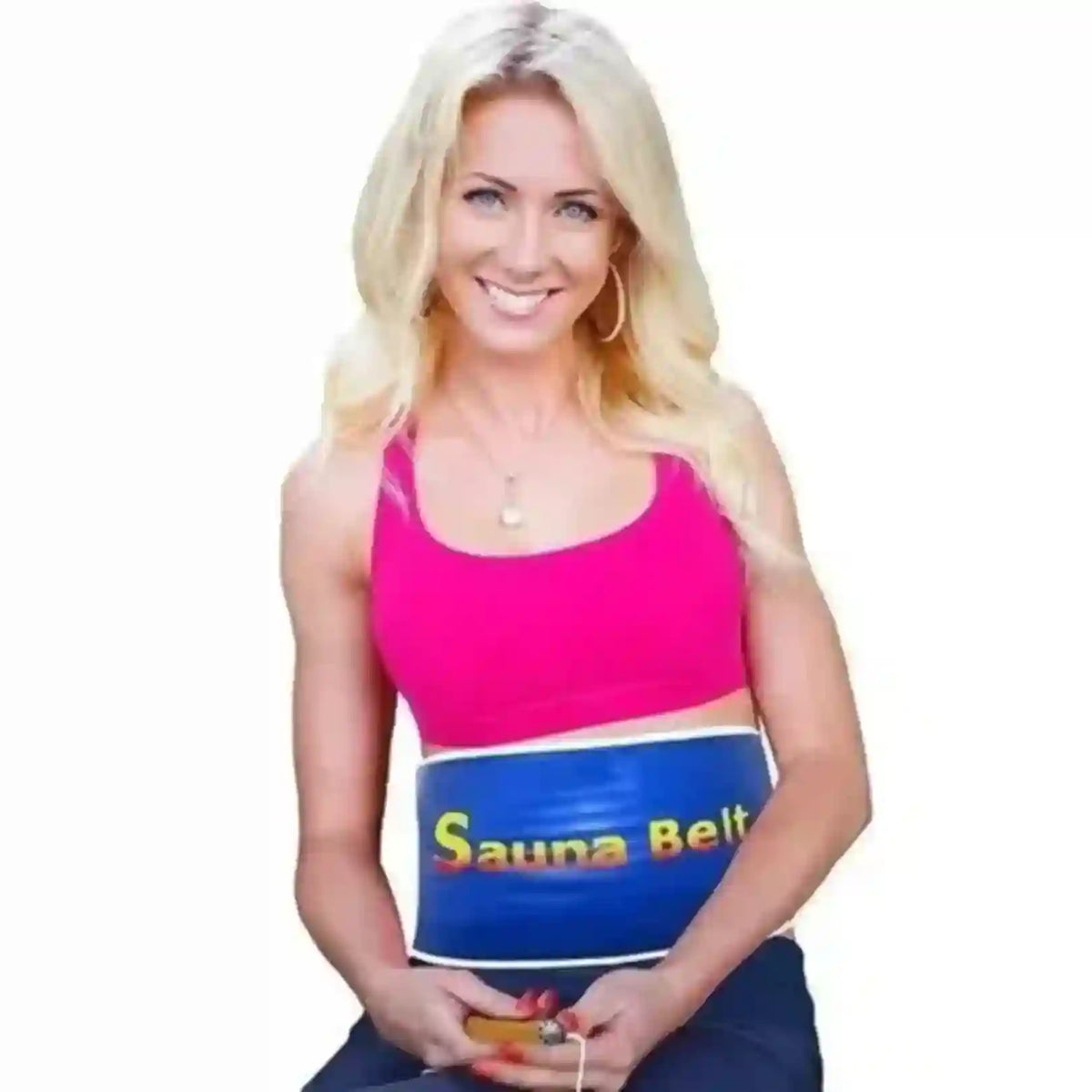 A blonde woman wearing a bright pink sports bra and a blue sauna belt around her waist, holding a small orange object against a plain white background.